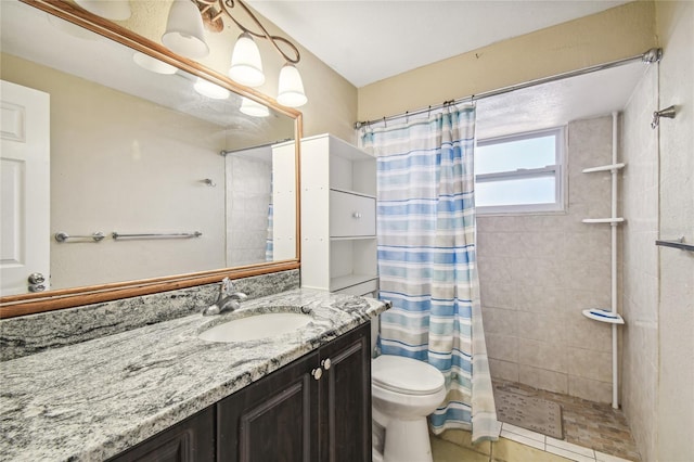 bathroom with a shower with shower curtain, vanity, toilet, and tile patterned flooring