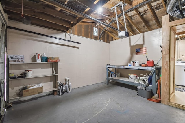 garage with washer / dryer and a garage door opener