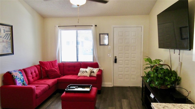 living room featuring a textured ceiling, ceiling fan, dark wood-type flooring, and lofted ceiling