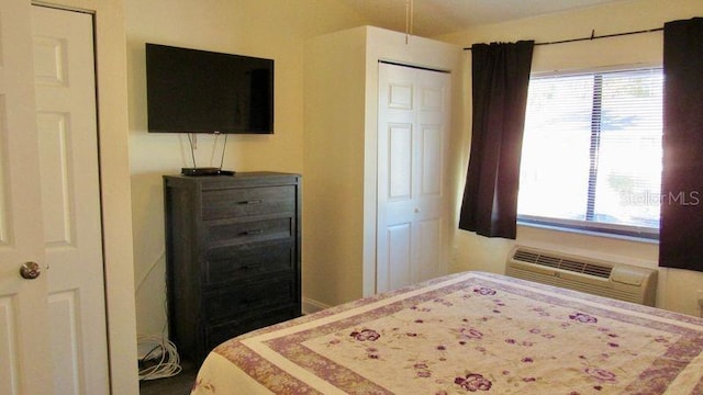 bedroom with a wall unit AC