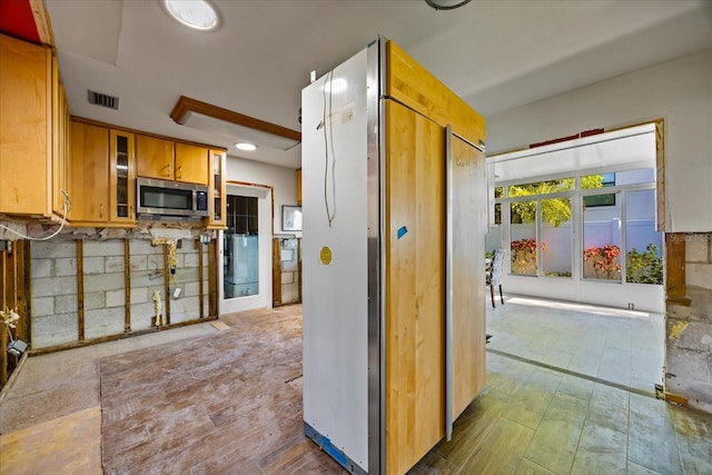 kitchen featuring backsplash and appliances with stainless steel finishes