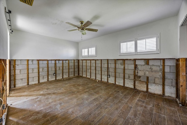 spare room with ceiling fan and wood-type flooring