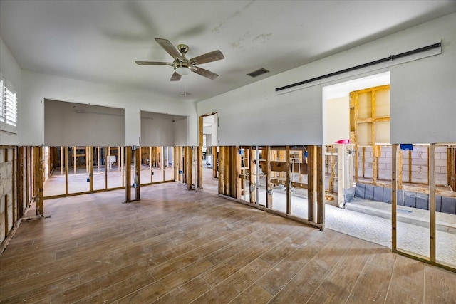 spare room with ceiling fan and wood-type flooring