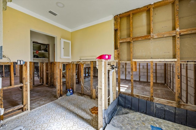 misc room featuring crown molding and hardwood / wood-style flooring