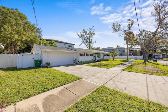 view of front of house featuring a front yard and a garage