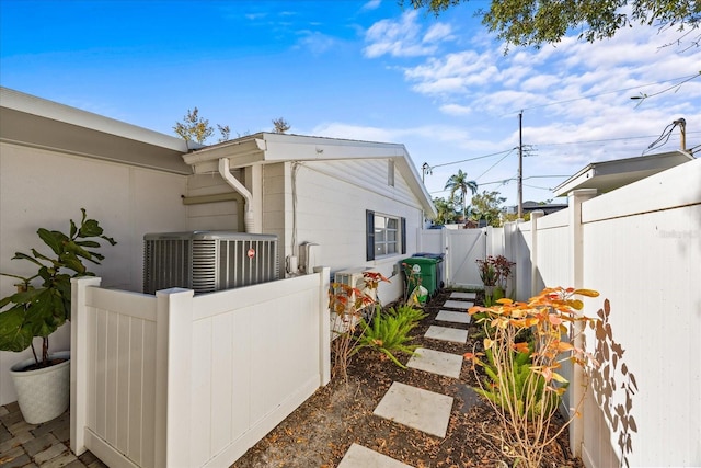 view of side of property with central AC unit