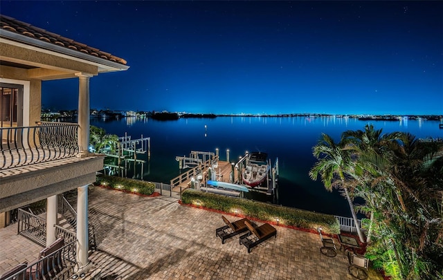 view of dock with a water view and a balcony