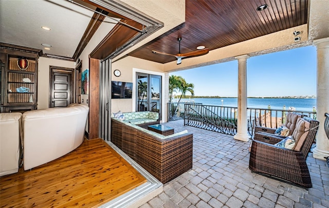 view of patio / terrace featuring ceiling fan