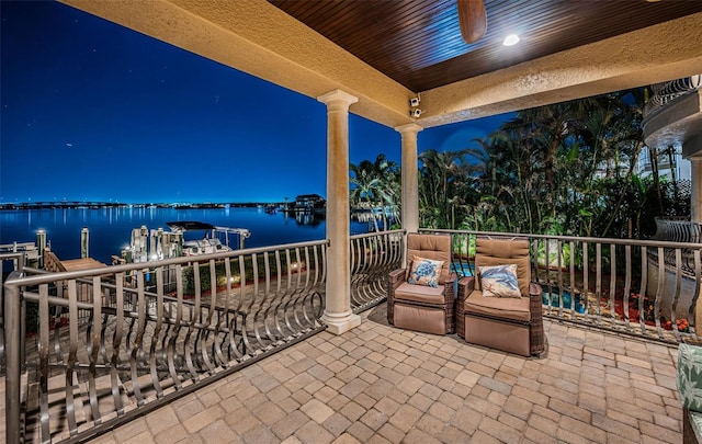 balcony at night with a water view