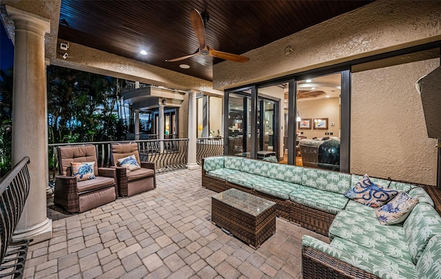 view of patio featuring ceiling fan and an outdoor living space