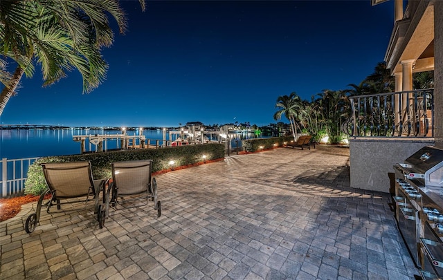 patio at night with a water view