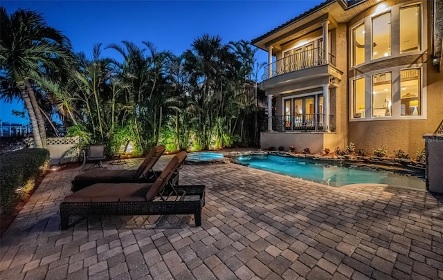 view of swimming pool with an in ground hot tub and a patio