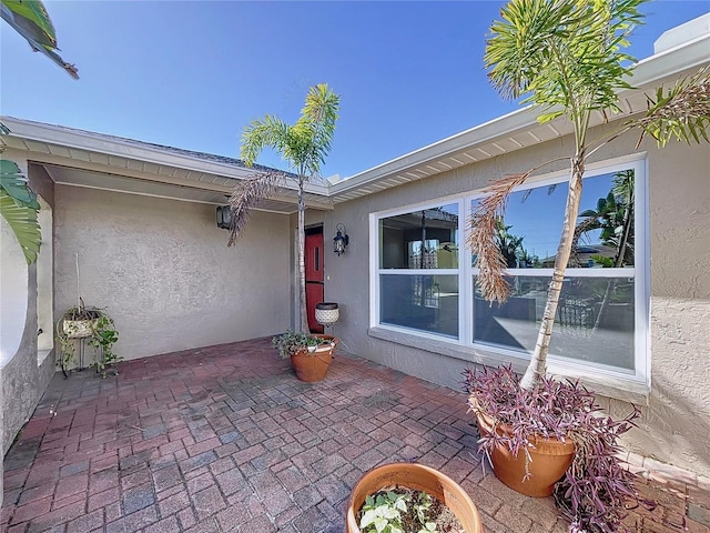 property entrance with a patio area