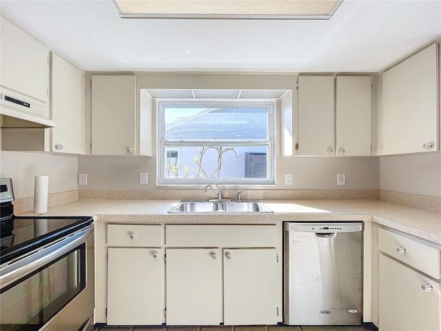 kitchen featuring white cabinets, extractor fan, sink, and appliances with stainless steel finishes