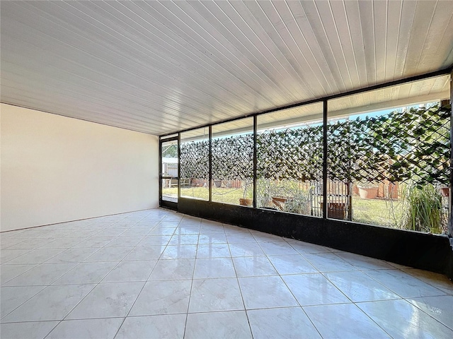 unfurnished sunroom featuring wood ceiling