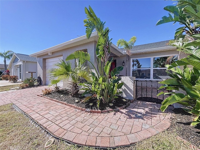 single story home featuring a garage