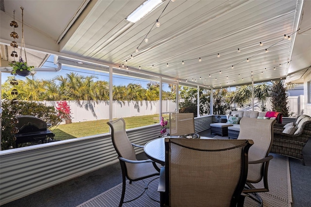 sunroom / solarium with vaulted ceiling