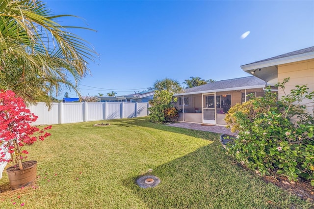 view of yard featuring a sunroom