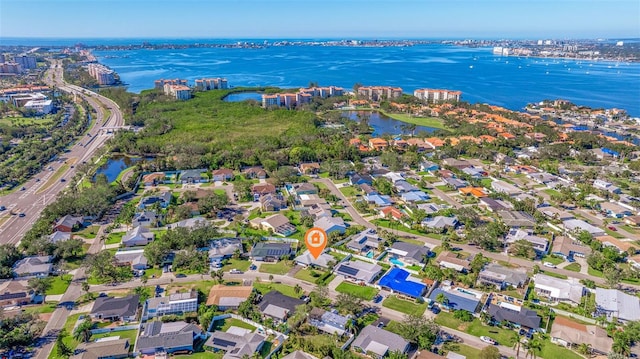 birds eye view of property with a water view