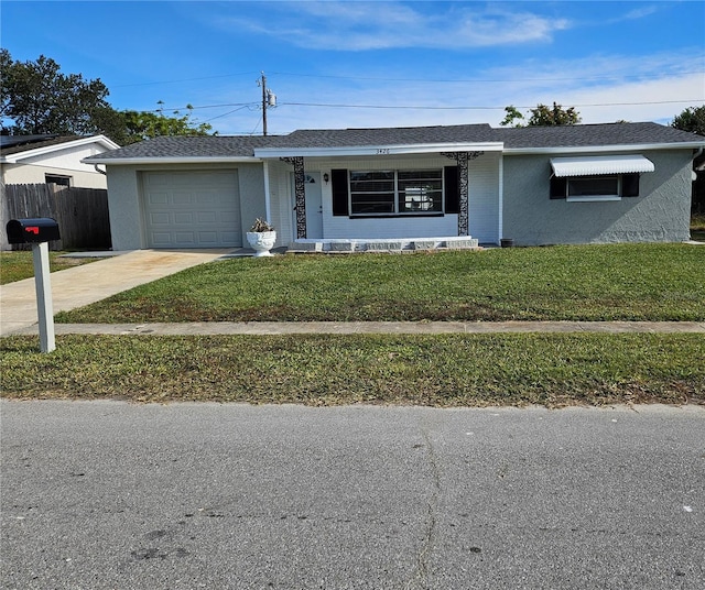 ranch-style house with a garage and a front lawn