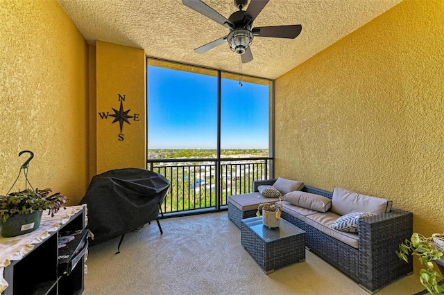 sunroom / solarium featuring ceiling fan