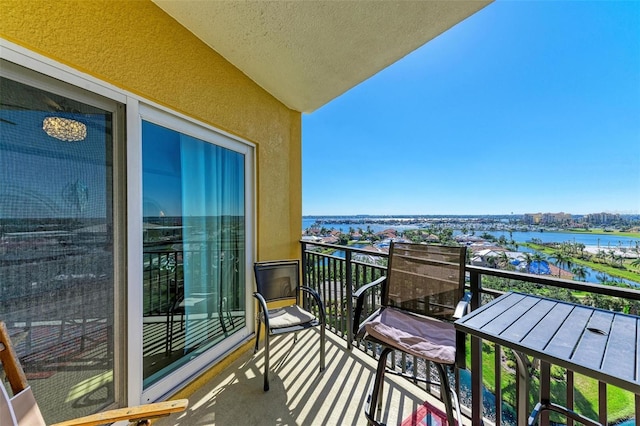 balcony featuring a water view