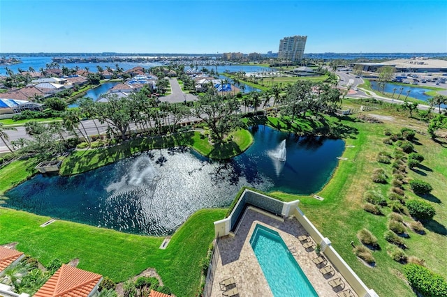 birds eye view of property with a water view