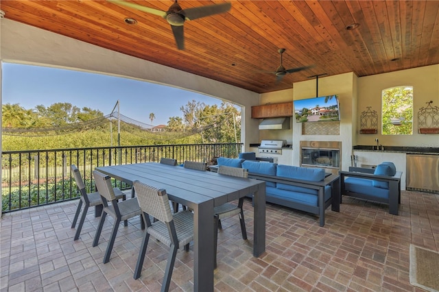 view of patio with an outdoor kitchen, area for grilling, outdoor lounge area, ceiling fan, and sink