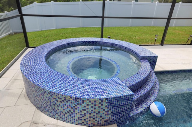 view of swimming pool with a hot tub and a lawn