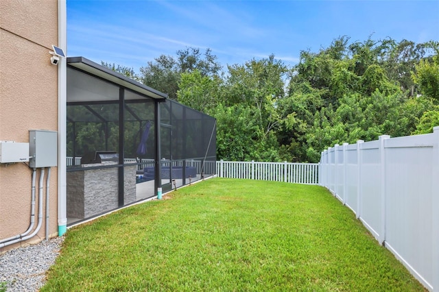 view of yard featuring a lanai