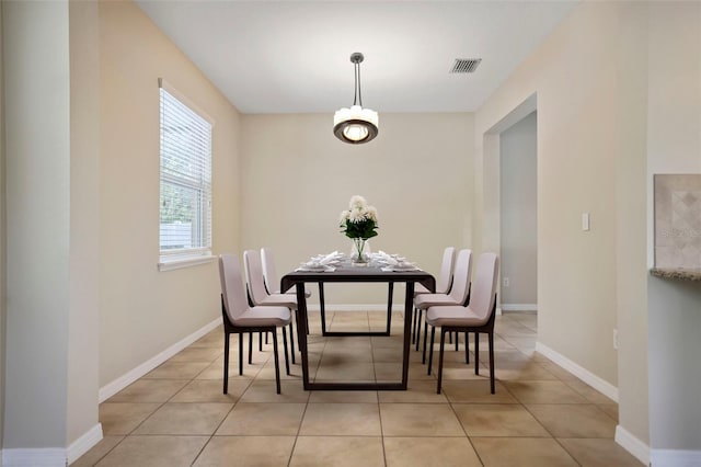 dining area with light tile patterned flooring