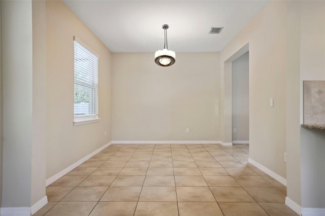 unfurnished dining area with light tile patterned floors