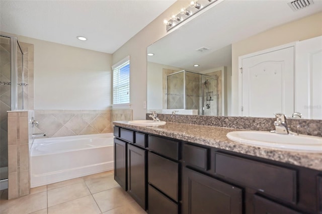 bathroom with tile patterned flooring, vanity, and independent shower and bath