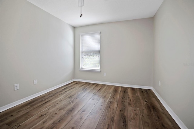 spare room with hardwood / wood-style floors