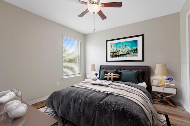 bedroom featuring ceiling fan and light hardwood / wood-style flooring