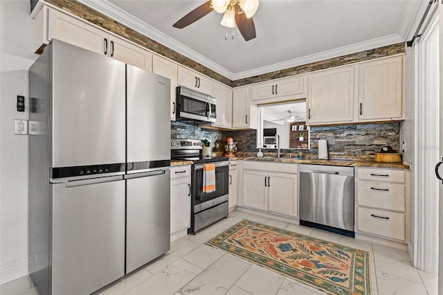 kitchen with ceiling fan, crown molding, white cabinetry, and stainless steel appliances