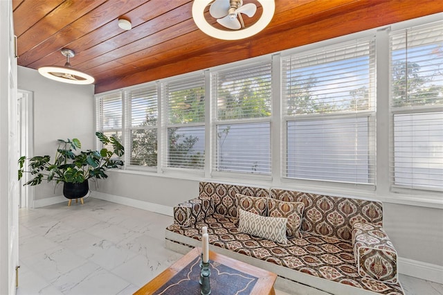 sunroom with a healthy amount of sunlight and wood ceiling