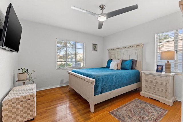 bedroom featuring ceiling fan and light hardwood / wood-style floors