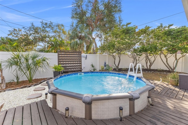 view of swimming pool featuring a wooden deck