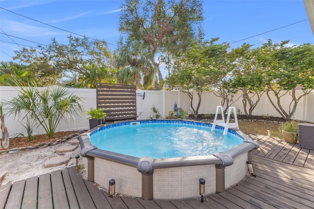 view of pool featuring a wooden deck