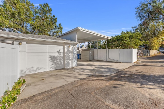 exterior space featuring a shed and a carport