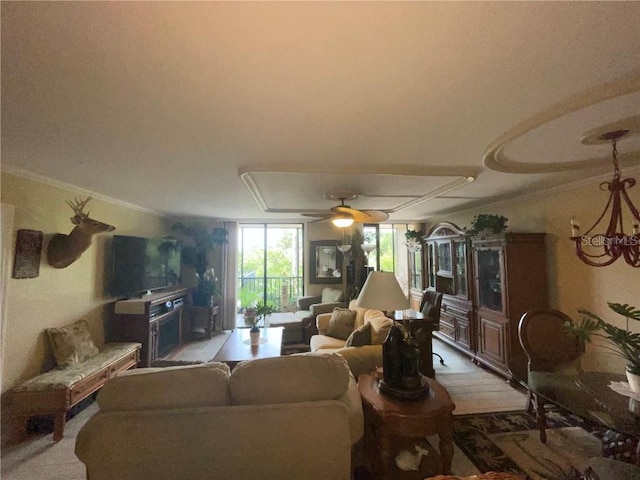 living room with carpet flooring, ceiling fan, and crown molding