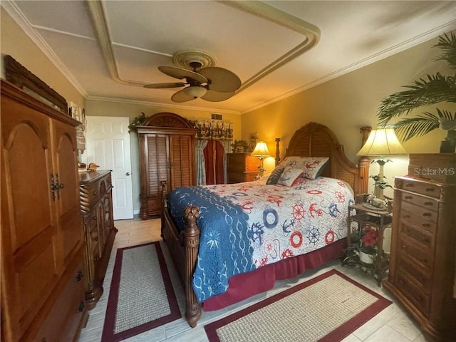 tiled bedroom with ceiling fan and crown molding