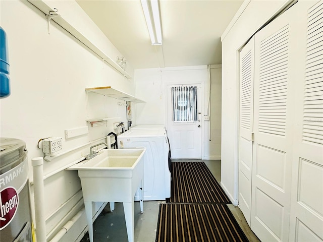 washroom with independent washer and dryer and sink