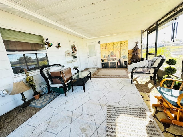 sunroom / solarium with plenty of natural light and wooden ceiling