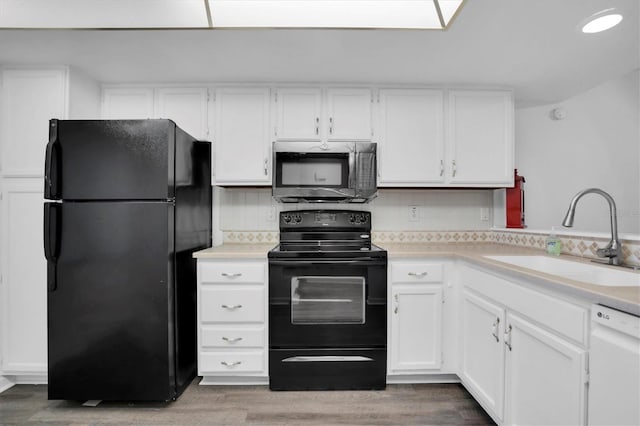 kitchen featuring black appliances, sink, decorative backsplash, dark hardwood / wood-style flooring, and white cabinetry