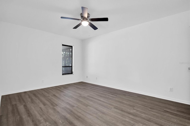 unfurnished room featuring dark hardwood / wood-style floors and ceiling fan