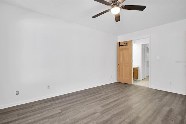 empty room featuring hardwood / wood-style flooring and ceiling fan