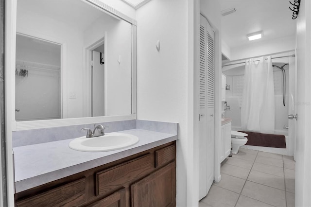 full bathroom featuring tile patterned flooring, vanity, toilet, and shower / tub combo