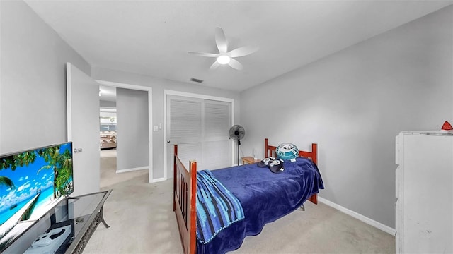 38919 3rd Ave, Zephyrhills, FL 33542 - bedroom featuring light colored carpet, a closet, and ceiling fan